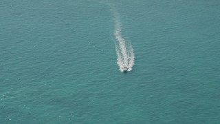 AX0025_144 - 5K stock footage aerial video approach speedboat near Overseas Highway, Conch Key, Marathon, Florida