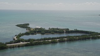 AX0025_148 - 5K aerial stock footage of flying by Conch Key Cottages, Little Conch Key, Marathon, Florida
