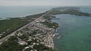 AX0025_153 - 5K aerial stock footage of flying by Pelican Carefree RV Resort, Marathon, Florida