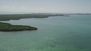 AX0025_161 - 5K aerial stock footage of flying by coastal mangroves, Fat Deer Key, Marathon, Florida