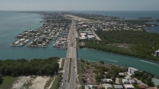 AX0025_164 - 5K stock footage aerial video of the Overseas Highway and Florida Keys Marathon Airport, Marathon, Florida