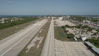 AX0026_001 - 5K aerial stock footage of lifting off from Florida Keys Marathon Airport, Marathon, Florida