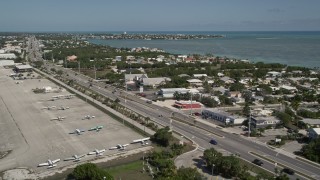 AX0026_002 - 5K stock footage aerial video fly by Overseas Highway, Florida Keys Marathon Airport, Marathon, Florida