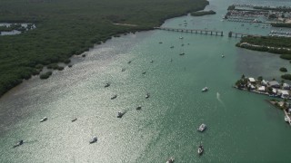 AX0026_010E - 5K stock footage aerial video of flying by sailboats and fishing boats in Boot Key Harbor, Marathon, Florida
