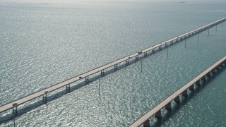 AX0026_017E - 5K aerial stock footage of approaching light traffic on the Seven Mile Bridge, Florida