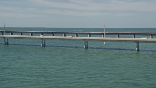 AX0026_020 - 5K aerial stock footage of a view of light traffic on the Seven Mile Bridge, Florida