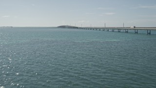 AX0026_021E - 5K aerial stock footage of flying by light traffic on the Seven Mile Bridge, Florida
