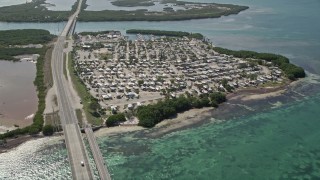 AX0026_033E - 5K stock footage aerial video of Overseas Highway, Sunshine Key RV and Camping Resort, Ohio Key, Florida