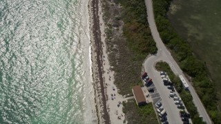 AX0026_036 - 5K aerial stock footage of bird's eye view of people on the beach, Bahai Honda Key, Florida