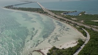 AX0026_037 - 5K aerial stock footage of flying by the Overseas Highway and the coast of Bahai Honda Key, Florida