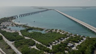 AX0026_038 - 5K aerial stock footage fly over RV park, approach sunbathers on beach, Bahai Honda Key, Florida