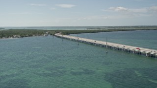 AX0026_044 - 5K aerial stock footage of Overseas Highway bridge near the Big Pine Key Fishing Lodge, Big Pine Key, Florida
