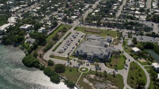AX0026_060 - 5K aerial stock footage of approaching Key West VA Outpatient Clinic, Key West, Florida