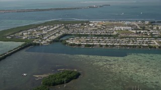 AX0026_063 - 5K aerial stock footage of approaching military housing on Sigsbee Park shore, Key West, Florida