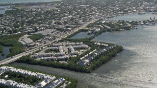AX0026_064 - 5K aerial stock footage of flying by condominiums on the shore of Key West, Florida