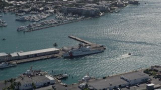AX0026_067 - 5K aerial stock footage of flying by US Coast Guard ship docked at Trumbo Point, Key West, Florida