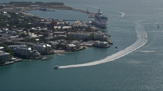 AX0026_068 - 5K aerial stock footage fly by hotels on the shore, approach Royal Caribbean ship, Key West, Florida