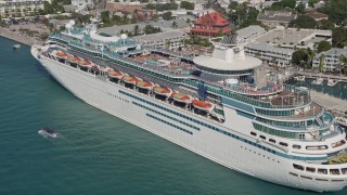 AX0026_072E - 5K aerial stock footage approach and flyby a Royal Caribbean Cruise Ship, docked, Key West, Florida