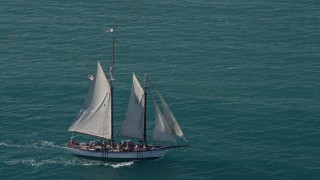 AX0026_106 - 5K aerial stock footage of a sailboat on the ocean near Key West, Florida