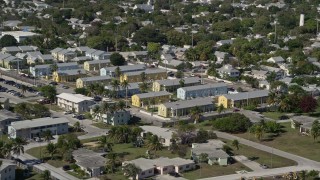 AX0026_112 - 5K aerial stock footage of flying by barracks at NAS Key West Truman Annex, Key West, Florida
