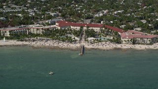 AX0026_115 - 5K aerial stock footage of Casa Marina, a beachfront hotel in Key West, Florida