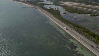 AX0027_004 - 5K aerial stock footage of flying by South Roosevelt Boulevard, Key West, Florida