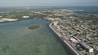 AX0027_029 - 5K aerial stock footage of flying by North Roosevelt Boulevard, reveal Stock Island, Key West, Florida