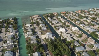 AX0027_042 - 5K aerial stock footage of flying over homes on canals, Big Coppitt Key, Florida
