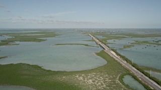 AX0027_045E - 5K aerial stock footage of following Overseas Highway, Saddlebunch Keys, Florida