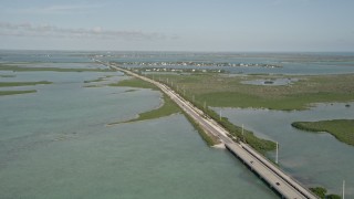 AX0027_047 - 5K aerial stock footage of following Overseas Highway, Saddlebunch Keys, Florida