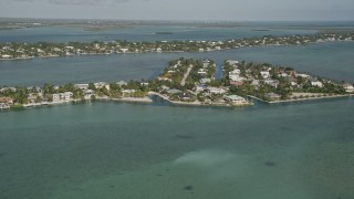 AX0027_048 - 5K aerial stock footage of approaching residential neighborhoods, Lower Sugarloaf Key, Florida