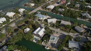 AX0027_051 - 5K aerial stock footage of flying over homes near the shore of Lower Sugarloaf Key, Florida