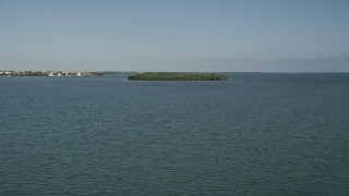 AX0027_061 - 5K aerial stock footage of flying low over Cudjoe Bay, toward mangroves, Cudjoe Key, Florida