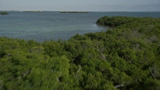 AX0027_062 - 5K aerial stock footage of flying over Cudjoe Bay, tilt to reveal mangroves, Cudjoe Key, Florida