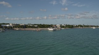AX0027_072 - 5K aerial stock footage of flying by homes and docks along the shore, Summerland Key, Florida
