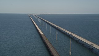 AX0027_076E - 5K aerial stock footage of cars traveling on Seven Mile Bridge, Florida