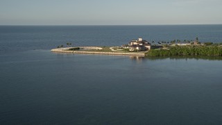 AX0028_003 - 5K stock footage aerial video of flying by the coast, near a mansion, Marathon, Florida