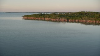 AX0028_026 - 5K aerial stock footage of flying over mangroves on at sunset, Islamorada, Florida