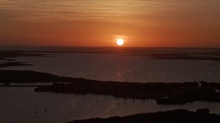 AX0028_043E - 5K aerial stock footage of flying by bays and mangrove islands, Key Largo, Florida, sunset