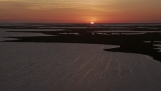 AX0028_048 - 5K aerial stock footage of flying by mangroves and bays, Key Largo, Florida, sunset