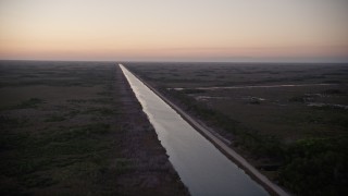 AX0028_053 - 5K aerial stock footage of Aerojet Canal, Southern Glades, Florida, twilight