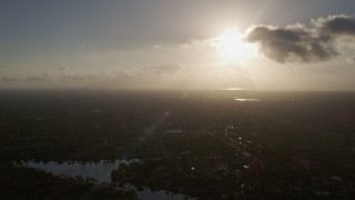 AX0029_001 - 5K aerial stock footage of flying over Kendall, Florida, sunrise