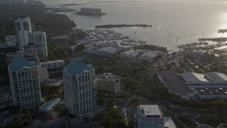 AX0029_006 - 5K aerial stock footage fly over office buildings, approach yacht clubs, Coconut Grove, Florida, sunrise