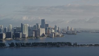 AX0029_009E - 5K aerial stock footage of flying by Downtown Miami skyline, Florida, sunrise