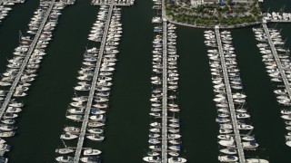 AX0031_016 - 5K aerial stock footage of flying by boats docked at Dinner Key, Coconut Grove, Florida