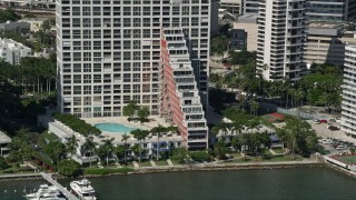 AX0031_022 - 5K aerial stock footage of an apartment building on the shore of Biscayne Bay, Miami, Florida