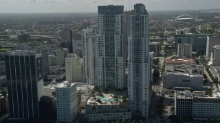 AX0031_027E - 5K aerial stock footage of approaching North and South Tower of Vizcayne, tilt to pool, Downtown Miami, Florida