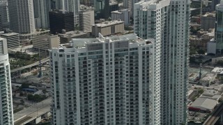AX0031_030 - 5K aerial stock footage of the top of Riverfront West tower, Downtown Miami, Florida