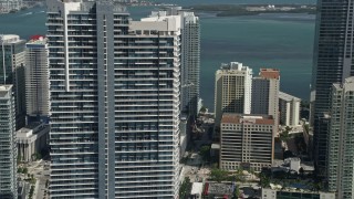 AX0031_032 - 5K aerial stock footage of flying by Infinity at Brickell, revealing Espirito Santo Plaza, Downtown Miami, Florida