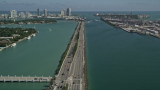 AX0031_043 - 5K aerial stock footage of flying over MacArthur Causeway, revealing South Beach, Miami Beach, Florida